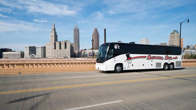 barons bus our fleet exterior running bridge skyline